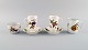 Royal Worcester, England. Two Evesham coffee cups with saucers, sugar bowl and 
cream jug in porcelain decorated with fruits and gold rim. 1980s.
