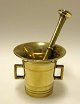 Brass mortar with pestle. With two handles and line decoration. 19th century. H: 10 cm. Pestle ...