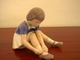 Bing & 
Grøndahl. The 
girl is tying 
her shoe. She 
has decoration 
number 2317 and 
is factory ...