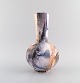 Arabia, 
Finland. Art 
deco vase in 
glazed faience. 
Beautiful 
marbled glaze. 
1920s/30s.
Measures: ...