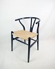 The Y chair, 
model CH24, 
designed by 
Hans J. Wegner 
in a dark blue 
color designed 
in 1950. We ...