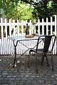 Old French bistro / café table with black cast iron base and top plate made of old zinc coated ...