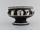 Wedgwood, England. Rare bowl in black stoneware with classicist scenes in white. 
1930s.
