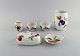 Royal Worcester, England. Six pieces of Evesham porcelain decorated with fruits 
and gold rim. 1980s.
