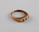 Scandinavian 
goldsmith. 
Vintage ring in 
8 carat gold 
adorned with 
three 
semi-precious 
stones. ...