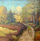 Virklund, Christian Jensen (1853 - 1938) Denmark: A road in a forest. Oil on canvas. Signed. ...