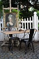 Old French bistro table with black iron base and old wooden top with a fine patina. H:71 cm. ...