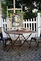 Old rough garden table from the South of France consisting of a wrought iron base with a super ...