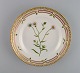 Royal Copenhagen Flora Danica salad plate in hand-painted porcelain with flowers 
and gold decoration. Model number 20/3573.
