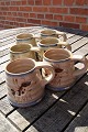 Knabstrup pottery & ceramics from Denmark.6 mugs with a happy pig and in a good used ...