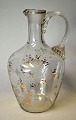Antique clear glass jug with etched flowers and gilding, 19th century With screw handle H.: 14.5 ...