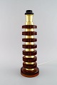 Swedish designer. Large table lamp in amber colored art glass and brass. 1970s.Measures: 40.5 ...