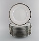 Sigvard 
Bernadotte for 
Christineholm. 
Twelve large 
dinner plates 
in porcelain 
with silver ...