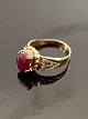 10 carat gold ring size 56-57 with ruby and several small diamonds item no. 511565