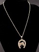 Pendant 2.5 x 
3.2 cm. 
sterling silver 
with horse 
motif from 
jewels B Hertz 
Copenhagen 
chain 39 ...