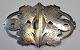 Silver belt 
with 
dolphin/fish 
decorations. 
approx. 1900. 
Stamped 826 and 
mastermarked 
AB. 6 x 9 ...