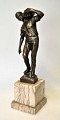 Beck, Ernst 
(1879 - 1941) 
Germany: The 
Stone Bearer. 
Patinated 
bronze on 
alabaster 
plinth. ...