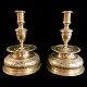 A pair of 
Baroque 
candlesticks,
made in brass. 
Germany 1732.  
H. 23,2 cm. 
Diam. 16,4 cm. 
...