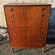 Chest of drawers in teak veneer from the 1960s with curved front. Appears to have fine handles ...