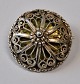 Filigree 
brooch, approx. 
1900. Norway. 
Stamped AS. 
Dia.: 3.5 cm.