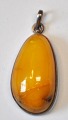Amber pendant 
with silver 
frame, A. 
MIchelsen, 20th 
century, 
Copenhagen, 
Denmark. 
Polished milk 
...