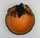 Ipsen's, 
Denmark. Art 
nouveau dish in 
hand-painted 
ceramics with 
grape vine and 
foliage. ...