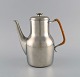 Just Andersen 
(1884-1943), 
Denmark. Art 
deco tin coffee 
pot with wicker 
handle. 1940s. 
Model ...