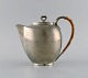 Just Andersen 
(1884-1943), 
Denmark. Art 
deco tin coffee 
pot with wicker 
handle. 1940s. 
Model ...