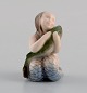 Royal Copenhagen porcelain figure. Little mermaid with fish. Model number 2348.
