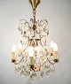 Prism crown made of brass and ground prisms from France around the 1920s. A brass canopy is ...