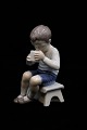 Bing & Grondahl 
porcelain 
figurine of a 
little boy 
drinking milk.
H:13cm. 
Decoration 
number: ...