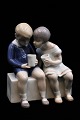 Bing & Grondahl 
porcelain 
figure of 
little boy and 
girl drinking 
milk.
H:14cm. 
Decoration ...