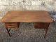 Freestanding desk in teak veneer with rounded corners and slightly curved front.Appears stable ...