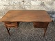 Freestanding 
desk in teak 
veneer with 
rounded corners 
and slightly 
curved front.
Appears stable 
...