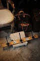 Old French coat rack in wood with fine patina, 3 metal hooks, and decorated with 2 old enamel ...