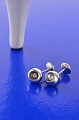 Georg Jensen pair of 'Cave' diamond earrings of 18 kt. white gold, each set with a brilliant-cut ...
