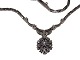 14 carat white gold necklace with pendant 
containing 16 diamonds