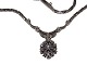 14 carat white 
gold necklace 
with pendant 
containing 16 
diamonds.
Marked "XX bi 
...
