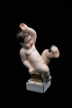 Old Bing & 
Grondahl 
porcelain 
figure in 
overglaze of a 
little boy with 
a fly. 
Height:15cm. Is 
...