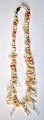 Coral necklace, 
20th century. 
With light, 
bright red 
corals. L.: 56 
cm.