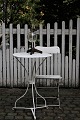Old round French cafe table in white painted metal with a fine patina. H:75cm. Dia.:50cm. ...