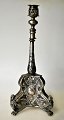 Rococo 
candlestick in 
silver and 
silver-plated 
brass, approx. 
1740 - 1760. On 
three lion's 
legs; ...