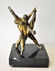 Unknown artist 
(20th century): 
Ballet. 
Patinated 
bronze 
sculpture. 
Unsigned. On a 
black marble 
...