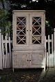 Old 2 part display cabinet in Gustavian style approx. Years 1880-1900.The display cabinet is ...
