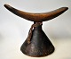 African 
headrest in 
wood, early 
20th century. 
With 
decorations on 
foot. H.: 15.5 
cm. W.: 21.5 
cm.