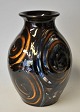 Danico vase, 20th century Horsens, Denmark. Reds with brown, blue and white glazes. Unstamped. ...