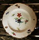Porcelain plate 
from approx. 
1850 with 
flower 
decoration and 
butterfly and 
ladybug. In 
good ...