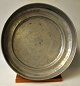 Large pewter 
dish on base, 
18th century. 
Indistinctly 
stamped. 
Engraved: M. 
Height: 6 cm. 
Dia.: ...