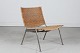 Poul Kjærholm styleLounge chair with metal frame,seat + back rest of plaited caneFrom ...
