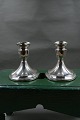 Pair of candlesticks of sterling silver on oval filled stand. Both are in a good used ...